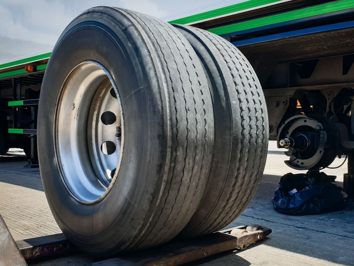 Truck tyre and trailer undercarriage at depot hardstand